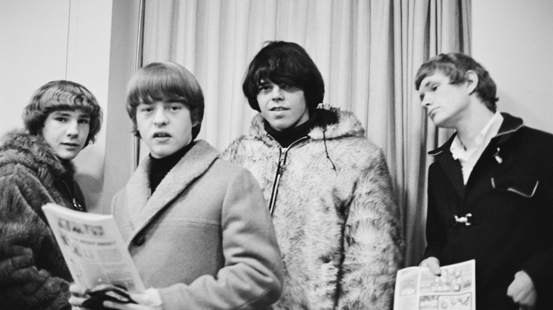 The band the McCoys holding newspapers in the 1960s