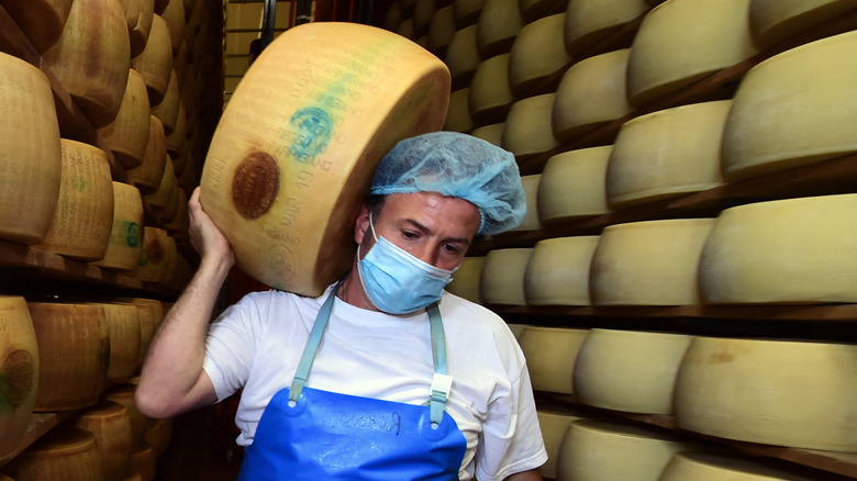 man carrying parmesan