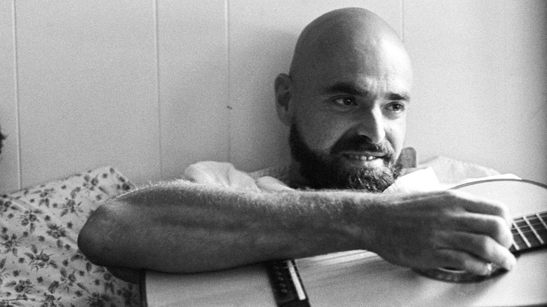 Shel Silverstein playing guitar