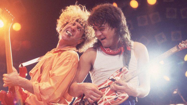 Sammy Hagar and Eddie Van Halen back to back playing guitar
