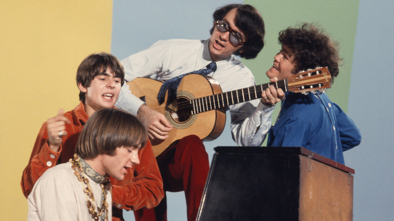 The Monkees playing music on the set of The Monkees