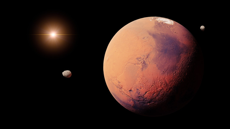 Mars, its two moons, and the Sun