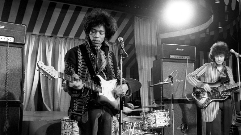 The Jimi Hendrix Experience performing on stage in the 1960s