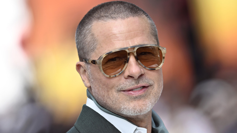 Brad Pitt smirking in sunglasses