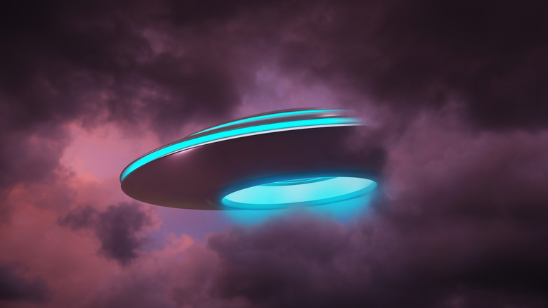 Alien space ship in clouds artists impression