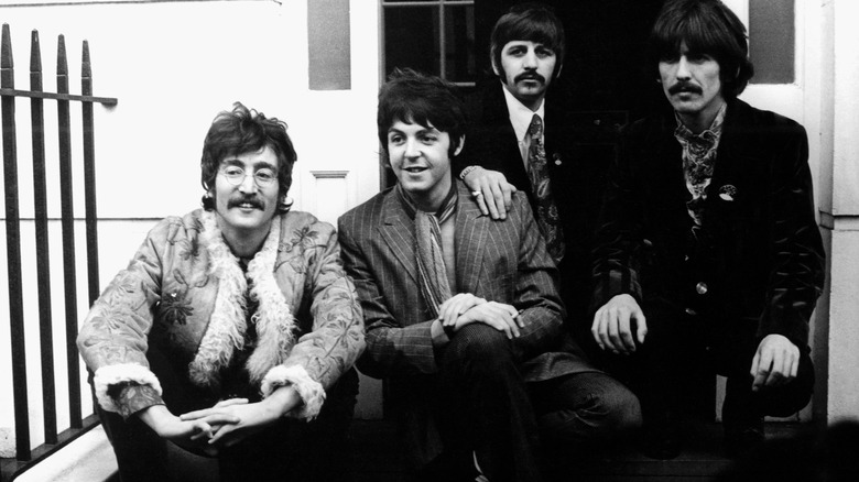 A black-and-white image of the Beatles posing together