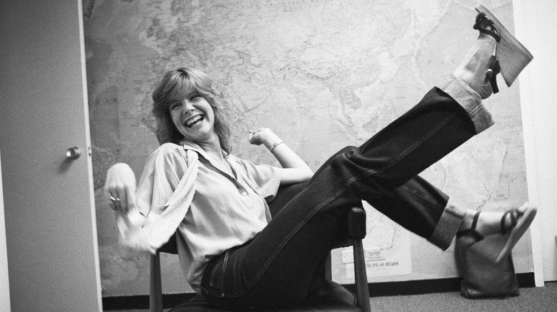 Debby Boone having fun in chair