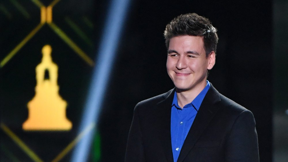 A photograph of James Holzhauer smiling.