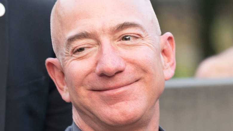 Jeff Bezos smugly thinking about how he can use the bathroom whenever he wants