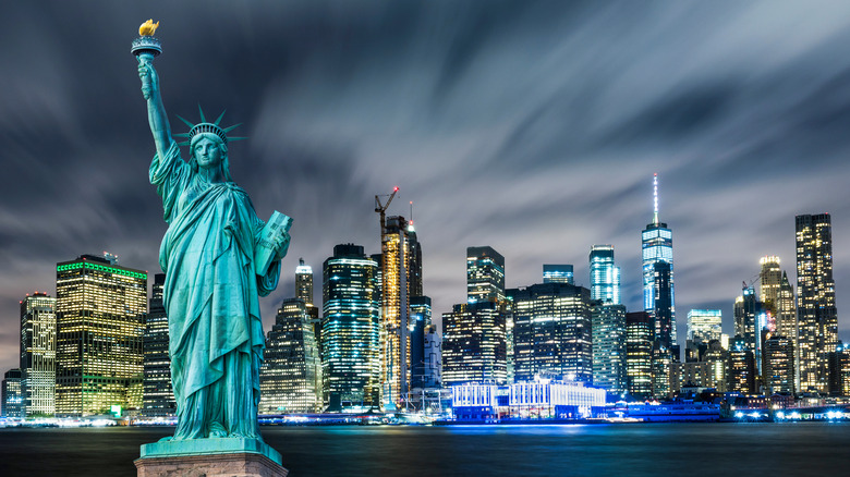 Manhattan stylized skyline with Statue of Liberty in foreground