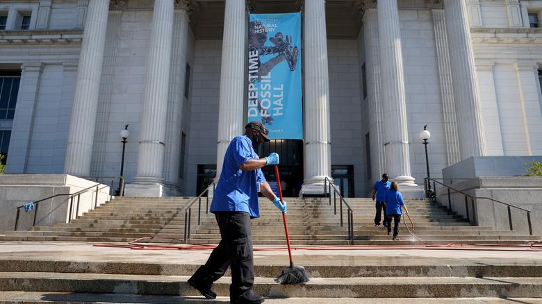 Man cleaning steps outside Smithsonian 