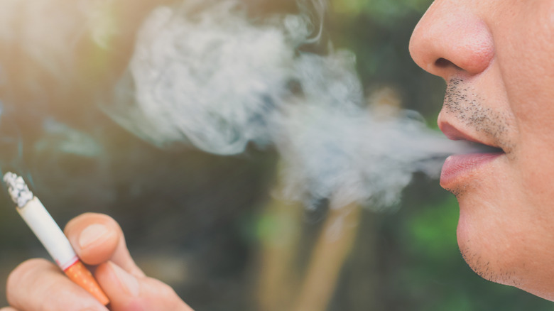 person smoking a cigarette