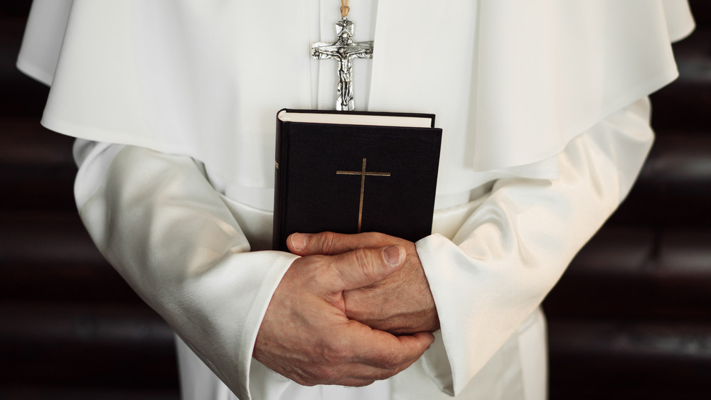 Pope holding a Bible