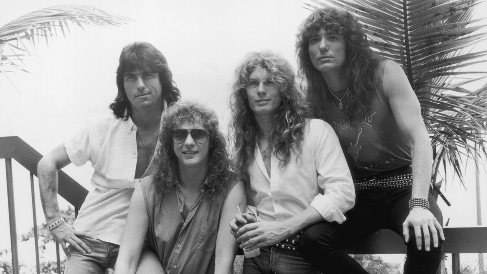 Whitesnake posing together outside