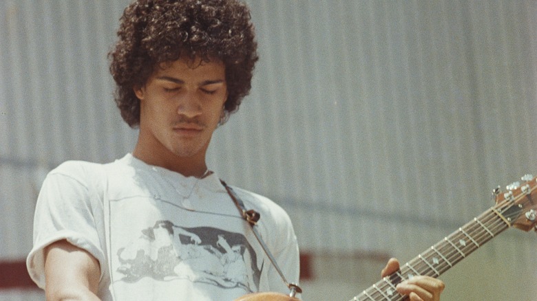 Slash as a teenager playing guitar