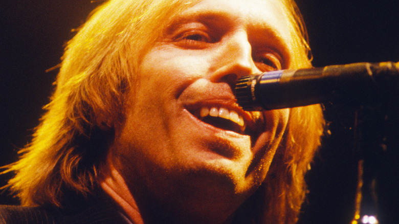 Tom Petty singing into microphone