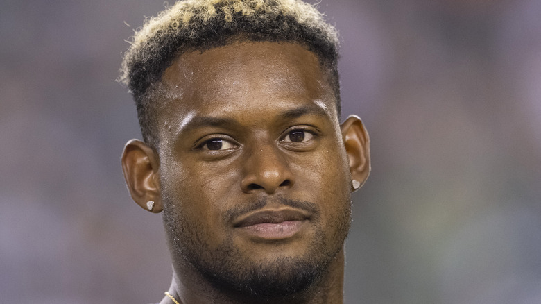 JuJu Smith-Schuster wearing earrings