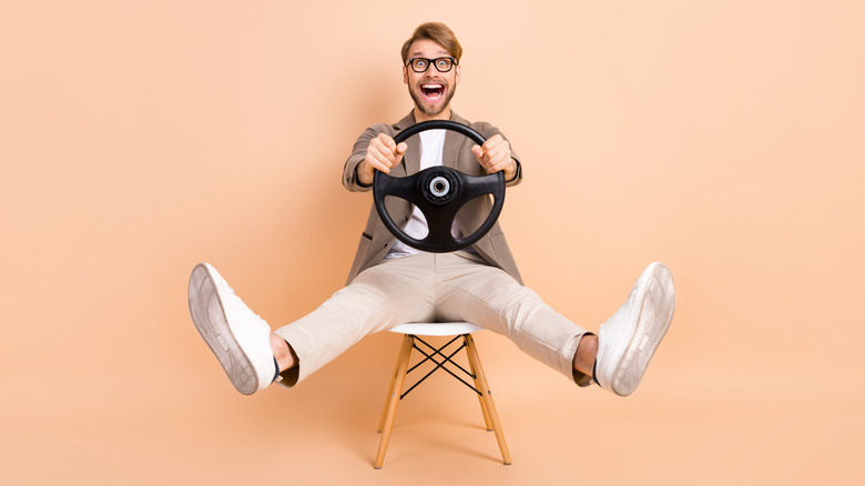 Person sitting pretending to drive