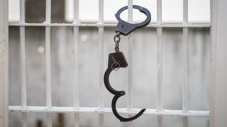 handcuffs on jail cell