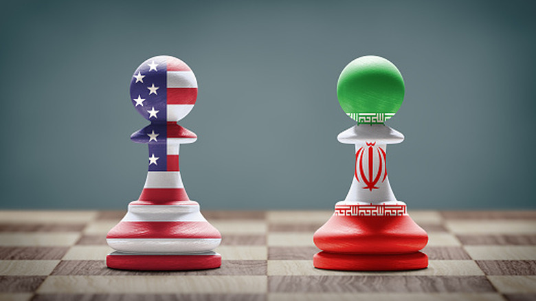 Chess pieces in colors and designs of U.S and Iranian flags