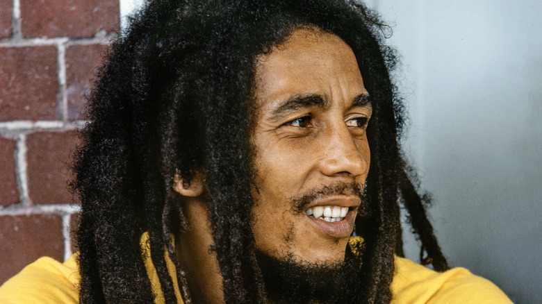 Bob Marley smiling yellow shirt