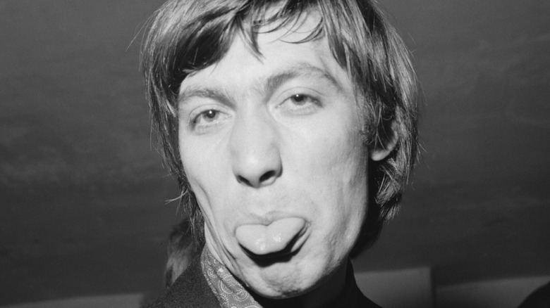 Charlie Watts sticking tongue out