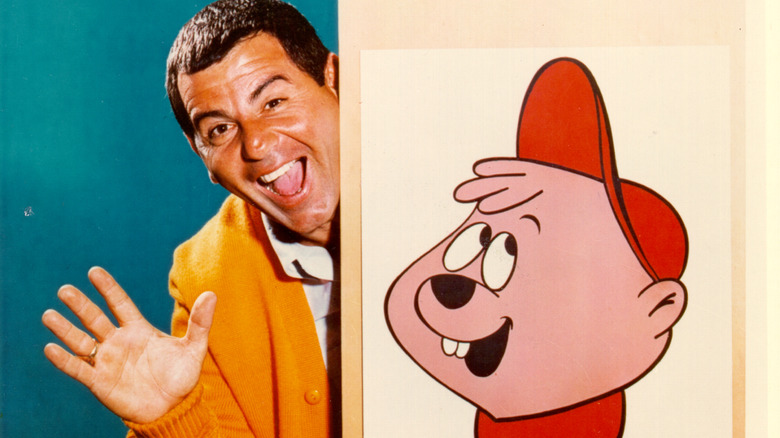 Ross Bagdasarian / David Seville waving next to picture of Alvin from the Chipmunks