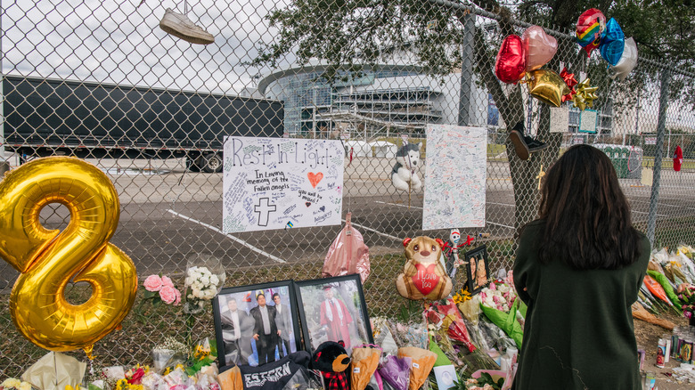 woman outside memorial Travis Scott Astroworld