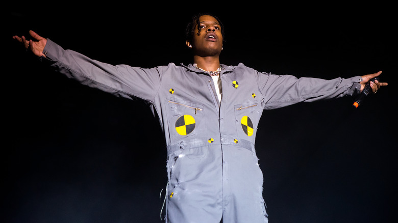 ASAP Rocky spreading his arms