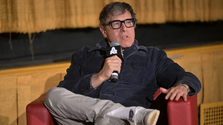 David O. Russell sitting on a chair and speaking