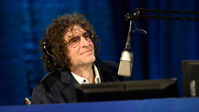 Howard Stern smiling at microphone