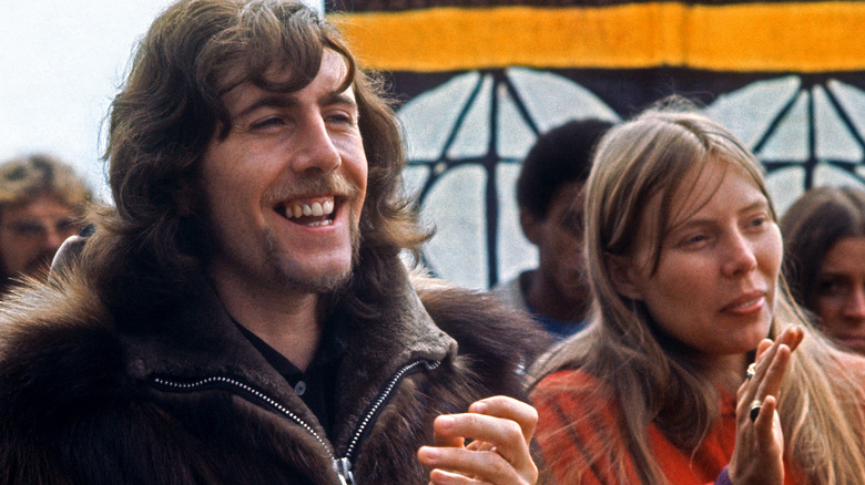 Graham Nash and Joni Mitchell clapping