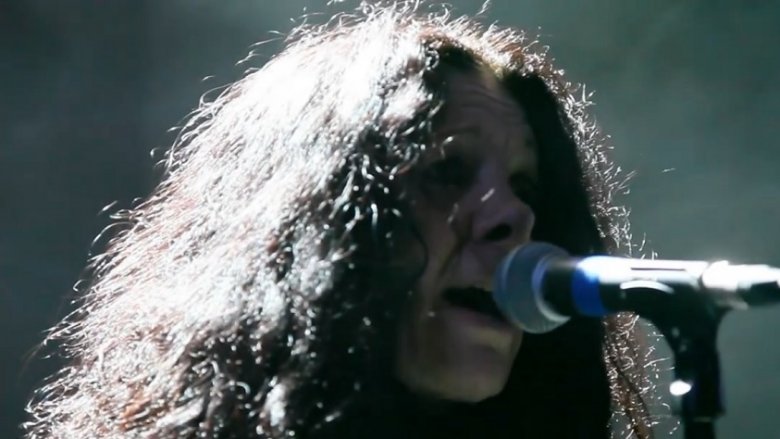 Johnette Napolitano long dark hair singing into mic