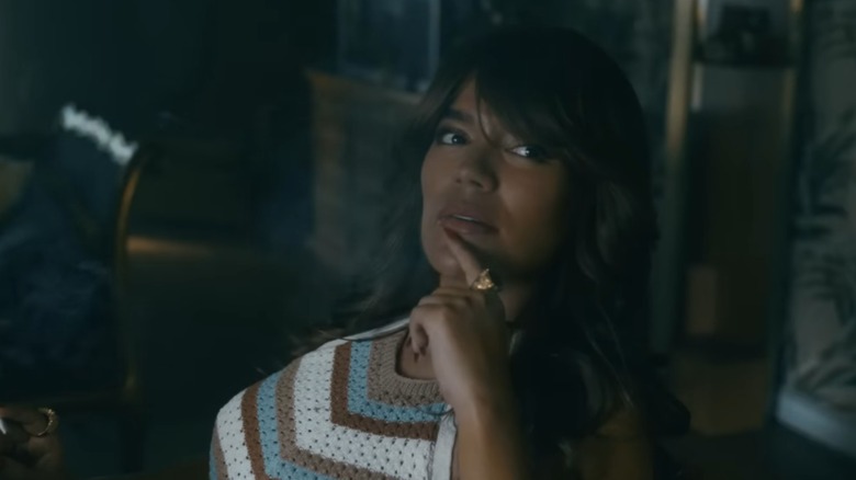 Karol G as Carla