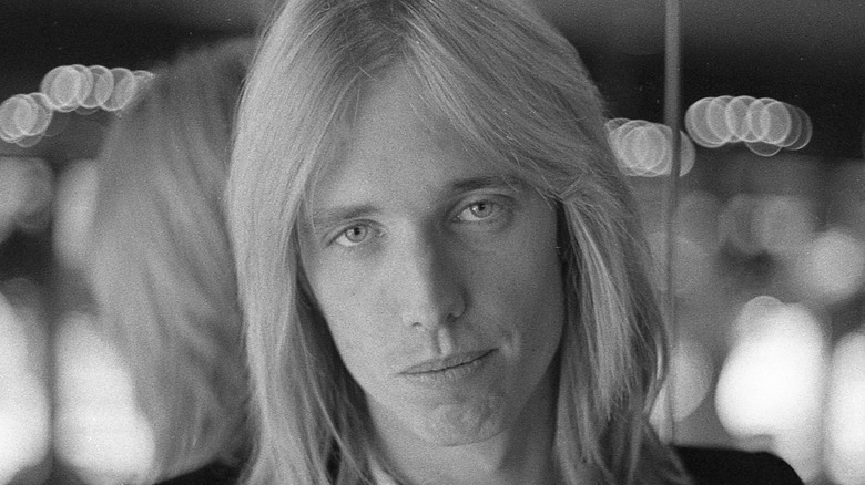 Tom Petty sitting on couch