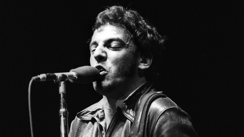 Bruce Springsteen singing at mic stand in 1981