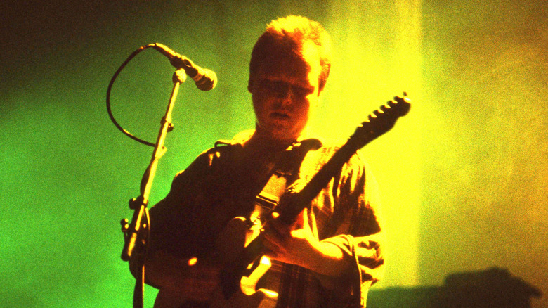 The Pixies' Black Francis playing on stage in 1991