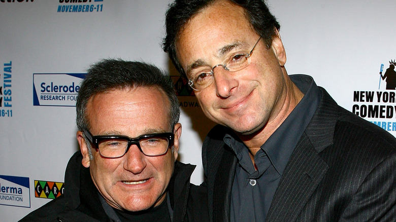Robin Williams and Bob Saget smiling 