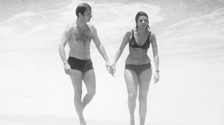 Sergei Kauzov and Christina Onassis hold hands