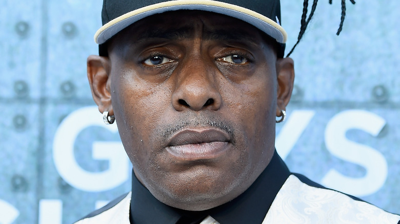 Coolio wearing a baseball cap