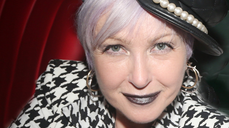 Cyndi Lauper smiling close-up in hat portrait