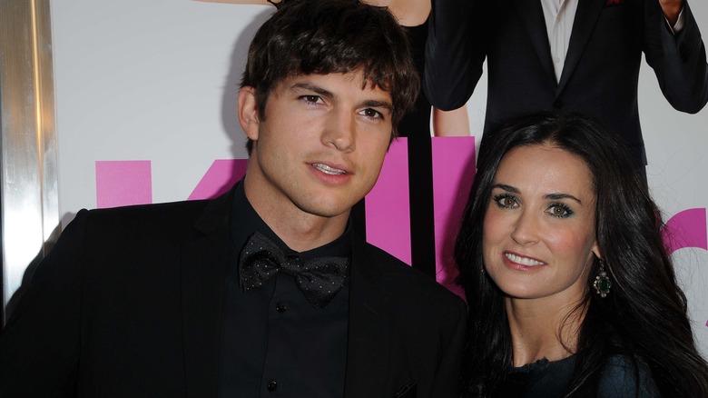 Ashton Kutcher and Demi Moore wearing black