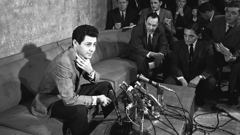 Eddie Fisher on a sofa being interviewed