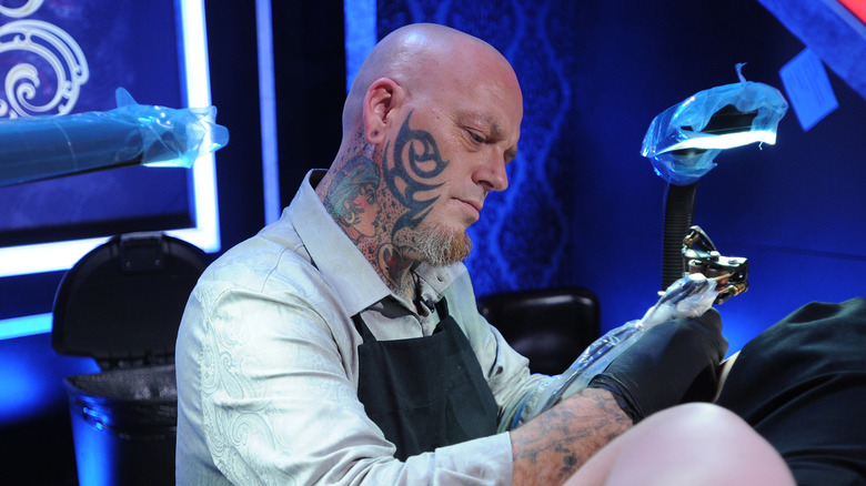 christian buckingham giving tattoo