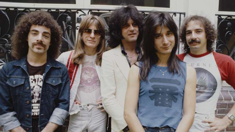 Journey band photo standing outside
