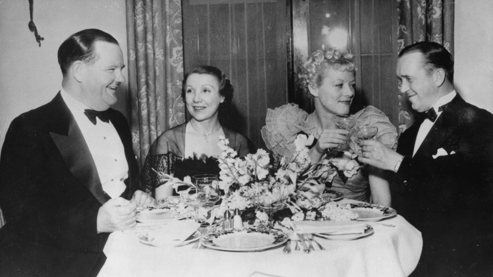 Oliver Hardy and Stan Laurel with their wives in 1935