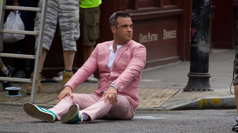 Williams sits on the street