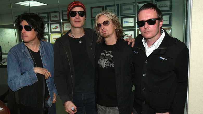 STP backstage wearing glasses