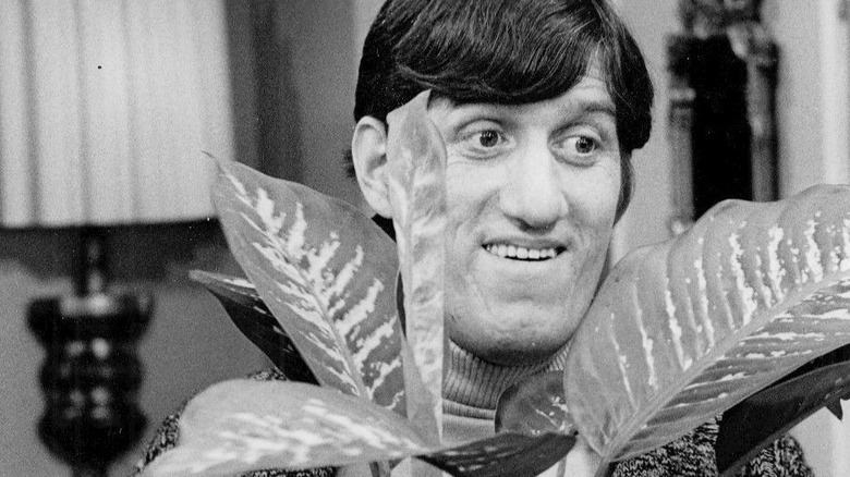 Paul Benedict with plant
