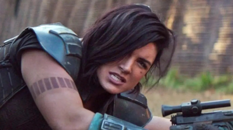 Gina Carano fighting in armor blaster